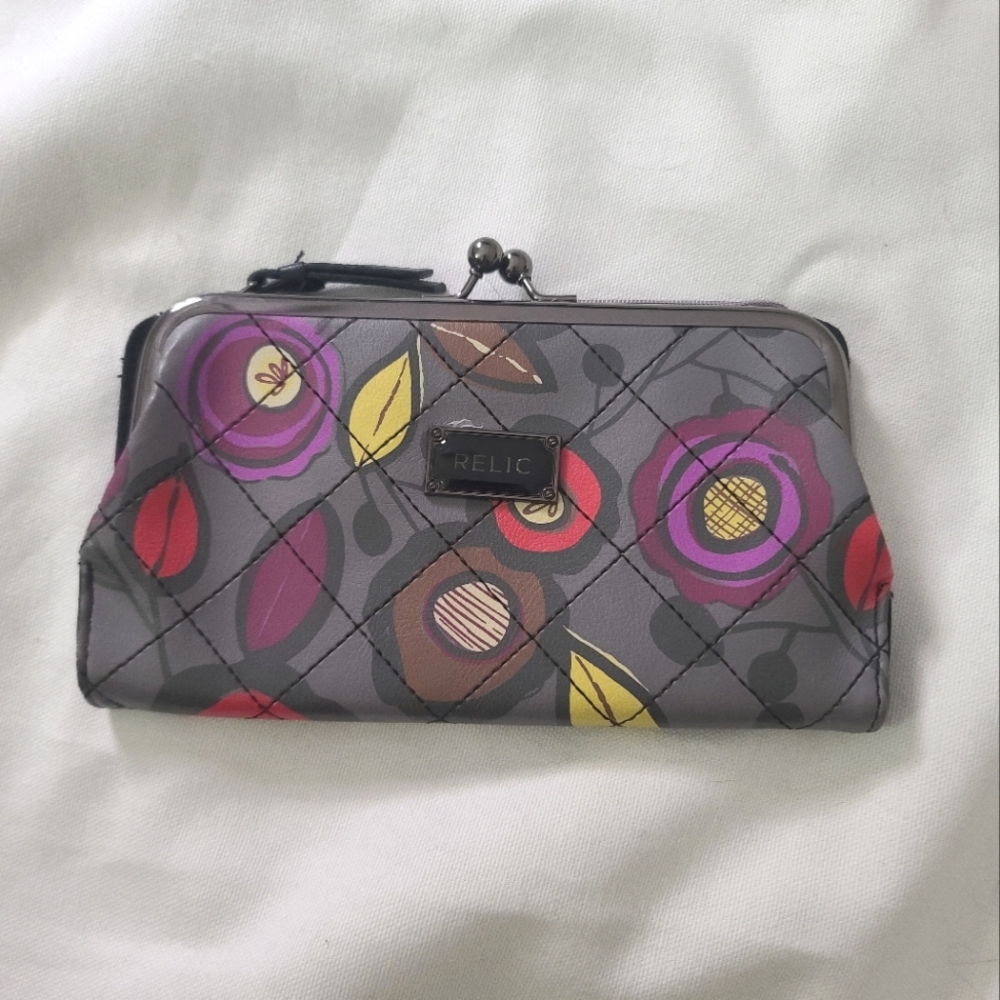 Relic wallet with clasp closure